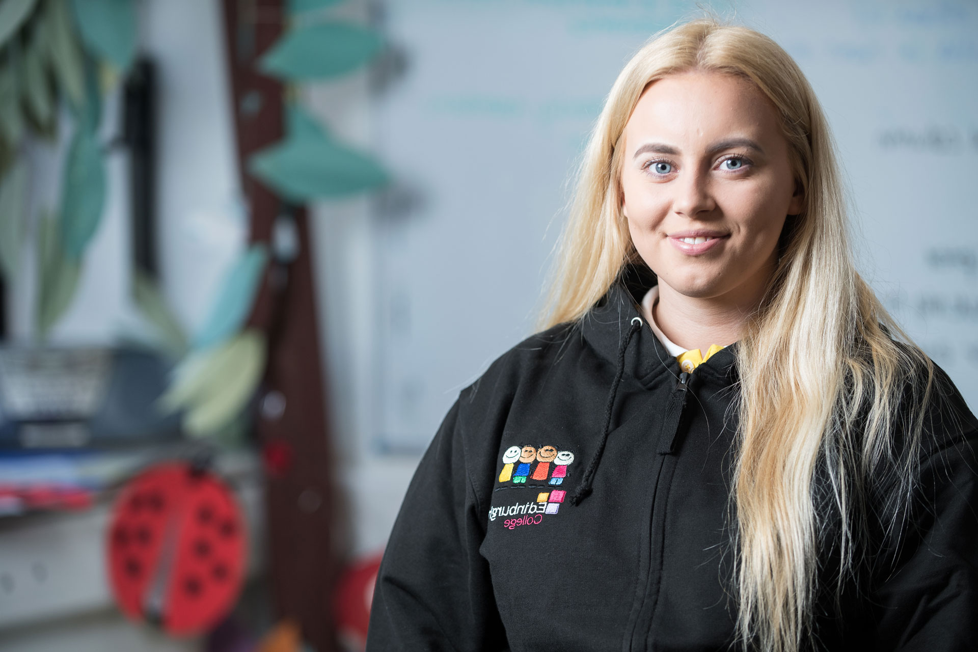 Childhood practice smiling in their classroom.